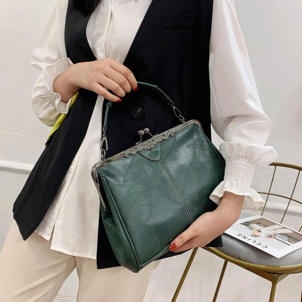 Bolso vintage con chiusura de scatto